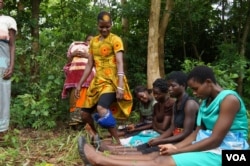 A counselor demonstrates a sexually suggestive dance during an initiation camp. (L Masina/VOA)