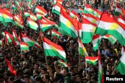 FILE - Kurds celebrate to show their support for the upcoming Sept. 25 independence referendum in Erbil, Iraq September 22, 2017.