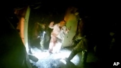 A video image from a helmet camera shows U.S. and Iraqi special forces freeing hostages from a prison controlled by Islamic State militants in the town of Huwija, 15 kilometers (9 miles) west of the Iraqi city of Kirkuk, Oct. 22, 2015.