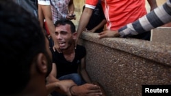 A relative of Palestinians who were killed at the Israel-Gaza border reacts in the southern Gaza Strip, Sept. 18, 2018.