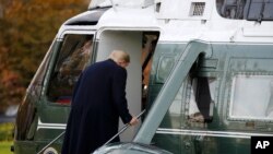 FILE - President Donald Trump boards Marine One on the South Lawn of the White House in Washington, Nov. 26, 2019, for a short trip to Andrews Air Force Base in nearby Maryland.