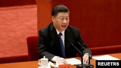 资料照片：2021年10月9日中国国家主席习近平在北京人民大会堂举行的“纪念辛亥革命110周年大会”上发表讲话。