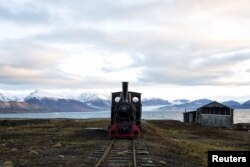 An old locomotive train that was used for transporting coal is preserved as a monument at Ny-Alesund, in Svalbard, Norway, Oct. 11, 2015.