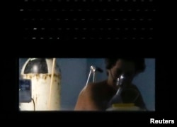 Teresa Romero, the Spanish nurse who contracted Ebola, is seen inside her room at an isolation ward on the sixth floor at Madrid's Carlos III Hospital, Oct. 11, 2014.