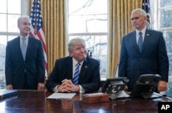 President Donald Trump, flanked by Health and Human Services Secretary Tom Price (left) and Vice President Mike Pence, told members of the media Friday that with the collapse of the health care overhaul bill, he would turn his attention to tax reform.