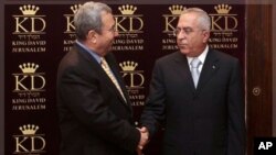 Israeli Defense Minister Ehud Barak, left, shakes hands with Palestinian Prime Minister Salam Fayyad (file photo).