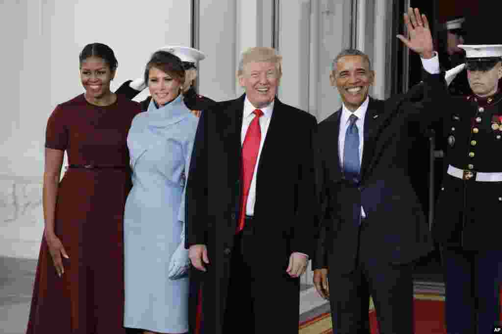 President Barack Obama and first lady Michelle Obama greets President-elect Donald Trump and his wife Melania Trump at the White House in Washington, Jan. 20, 2017. 