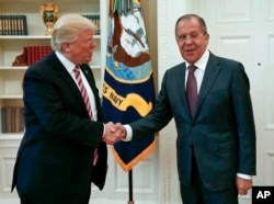 U.S. President Donald Trump shakes hands with Russian Foreign Minister Sergey Lavrov in the White House in Washington, May 10, 2017. (Russian Foreign Ministry photo via AP)