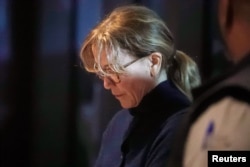 FILE - Actor Felicity Huffman leaves an initial hearing for defendants in a racketeering case involving the allegedly fraudulent admission of children to elite universities, at the U.S. federal courthouse in downtown Los Angeles, California.