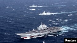 China's Liaoning aircraft carrier with accompanying fleet conducts a drill in an area of the South China Sea, in this photo taken December 2016.