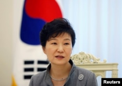 FILE - South Korean President Park Geun-hye speaks during an interview at the Presidential Blue House in Seoul, Sept. 16, 2014.