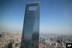 This June 25, 2009 file photo shows the Shanghai World Financial Center in Shanghai, China.