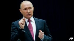 Russian President Vladimir Putin gestures while speaking to the media after his annual televised call-in show in Moscow, Russia, June 15, 2017. 