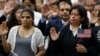 FILE - Immigrants take the citizenship oath during naturalization ceremonies at a U.S. Citizenship and Immigration Services ceremony in Los Angeles, California, Sept. 20, 2017. In the 2019 fiscal year, the U.S. will limit refugee admissions to 30,000.