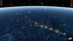 ພາບນີ້ ເປັນໜ້າເວັບໄຊ້ ຕິດຕາມ ແຊນຕ້າ ຫຼື NORAD Track Santa ເມື່ອວັນທີ 24 ທັນວາ 2021 (AP)