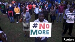People sing as they attend a memorial concert at the "Freedom Corner" in Kenya's capital Nairobi, April 14, 2015, in memory of the Garissa university students who were killed by gunmen.