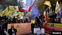 FILE - Demonstrators protest outside India's consulate in Toronto on Sept. 25, 2023, a week after Canadian Prime Minister Justin Trudeau raised the prospect of India's involvement in the murder of Sikh separatist leader Hardeep Singh Nijjar in Vancouver, British Columbia.