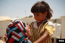 Just over a year old, Morhaf's brother, Rafaat, is malnourished because he can't eat or drink without getting sick, at the Za'atari camp in Jordan, June 17, 2015. (Photo: H. Murdock / VOA)