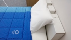 A cardboard bed is photographed in a display room showing furniture for the Tokyo 2020 Olympic and Paralympic Villages Thursday, Jan. 9, 2020, in Tokyo. (AP Photo/Jae C. Hong)