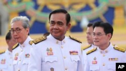 Thailand's Prime Minister Prayuth Chan-ocha leads his 36 cabinet members to take their oaths in Bangkok, in front of King Maha Vajiralongkorn, July 16, 2019.