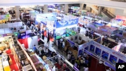 FILE - People attend the 20th Pyongyang Spring International Trade Fair in Pyongyang, North Korea, May 22, 2017. Countries participating in the fair include Belarus, China, Iran, Italy, Indonesia, Vietnam and Cuba.