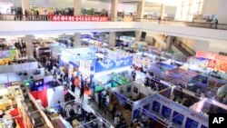 FILE - People attend the 20th Pyongyang Spring International Trade Fair in Pyongyang, North Korea, May 22, 2017. Countries participating in the fair include Belarus, China, Iran, Italy, Indonesia, Vietnam and Cuba.