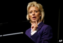 FILE - Republican Shantel Krebs speaks with supporters after winning the South Dakota Secretary of State race at an election night party in Sioux Falls, S.D., Nov. 4, 2014.