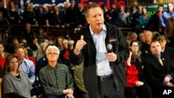 Republican presidential candidate Gov. John Kasich of Ohio speaks during a campaign stop at a high school before Tuesday's first-in-the-nation presidential primary, in Concord, New Hampshire, Feb. 7, 2016.