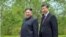 FILE - Chinese President Xi Jinping and North Korean leader Kim Jong Un walk during Xi's visit in Pyongyang, North Korea, in this picture released by North Korea's Korean Central News Agency on June 21, 2019.