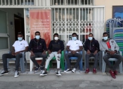 FILE - Ethiopian migrants who survived the Mozambique tragedy when 64 died in a metal container, are seen at the International Organization for Migration offices in Addis Ababa, Ethiopia, May 14, 2020.