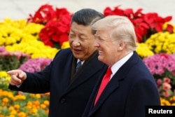 U.S. President Donald Trump and China's President Xi Jinping attend a welcoming ceremony in Beijing, Nov. 9, 2017.