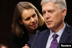 Supreme Court nominee judge Neil Gorsuch speaks with his wife, Marie Louise, during a break in his confirmation hearing before the Senate Judiciary Committee on Capitol Hill in Washington, March 21, 2017.
