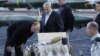 Israel's Prime Minister Benjamin Netanyahu (2nd L) and Defense Minister Moshe Yaalon (L) look at a display of mortar shells, found aboard the Klos C ship, at a navy base in the Red Sea resort city of Eilat on March 10, 2014. 