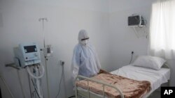 A medical staff member works on setting up an isolation room at a coronavirus quarantine ward at a hospital in Sanaa, Yemen, March 15, 2020. 