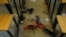 FILE - Shoes of the kidnapped students from Government Science Secondary School are seen inside their classroom in Kankara, Nigeria, Dec. 16, 2020. 