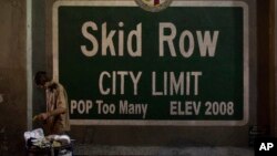 A homeless man takes food from a trash can in Los Angeles' Skid Row area, home to the nation's largest concentration of homeless people, Oct. 28, 2017, in Los Angeles. California declared a statewide emergency because of a hepatitis A outbreak linked to homeless encampments. Comparisons are being made to conditions more commonly seen in Third World countries.