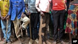 Former child soldiers stand in line waiting to be registered with UNICEF to receive a release package, in Yambio, South Sudan Wednesday, Feb. 7, 2018. 