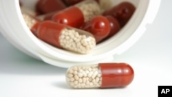 FILE - Antibiotic pills. Antimicrobial resistance occurs when antibiotics and other drugs that were once used successfully to treat bacteria, viruses, parasites and fungi no longer work to fight infections. Used improperly, the once-miracle drugs cause microbes to develop mutations that render them ineffective. 