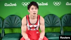 Japanese gymnast Kohei Uchimura pauses during a workout at the Rio Olympic Arena in Rio de Janeiro, Aug. 3, 2016. 