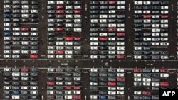 FILE - An aerial view shows lines of new Honda cars parked up at the Royal Portbury Dock in Avonmouth, near Bristol in south-west England, Dec. 4, 2020. The absence of a Brexit deal would alter the once almost seamless trade between the UK and the EU.
