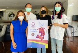 VOA's Thai Janine Phakdeetham (left), Panipak's father (second left), and Olympic Gold Medalist in Tae Known Do Panipak Wongpattanakit (right) in Phuket, Thailand