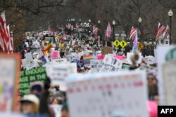 Demonstranti na skupu održanom uoči inauguracije novoizabranog predsjednika Donalda Trumpa (Foto: AFP/MATTHEW HATCHER)