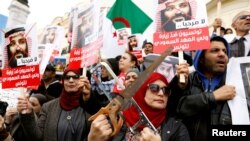 Tunisians take part in a protest, opposing the visit of Saudi Arabia's Crown Prince Mohammed bin Salman in Tunis, Nov. 27, 2018.