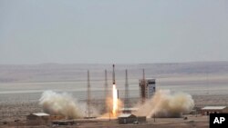 This photo, released by the official website of the Iranian Defense Ministry, July 27, 2017, claims to show the launching of Simorgh satellite-carrying rocket in an undisclosed location in Iran.