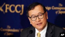 Scores of Cambodia's former opposition members and activists were summoned to court, self-exiled opposition leader Sam Rainsy was sentenced to prison.