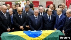 Brazilian President Michel Temer, center, attends the wake of Brazilian Supreme Court Justice Teori Zavascki in Porto Alegre, Brazil, Jan. 21, 2017.