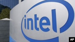 FILE - The Intel Corp. company logo is displayed at its headquarters in Santa Clara, California, Sept. 5, 2006.