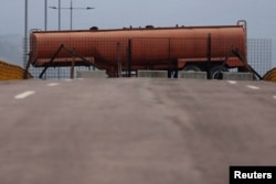 Fuel tank blocks the vehicular passage on Tienditas cross-border bridge between Colombia and Venezuela, in Cucuta, Colombia, Feb. 6, 2019.