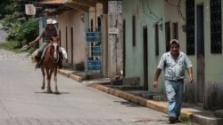 Residents are seen at a street in El Paraiso, Honduras July 24, 2021.