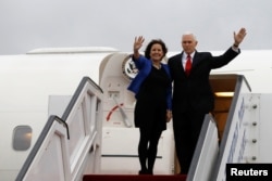 FILE - U.S. Vice President Mike Pence and his wife, Karen, wave as they prepare to depart Ben Gurion International Airport, near Tel Aviv, Israel, Jan. 23, 2018. The Pences leave Monday for a trip to Northeast Asia, including a stop at the Pyeongchang Gam